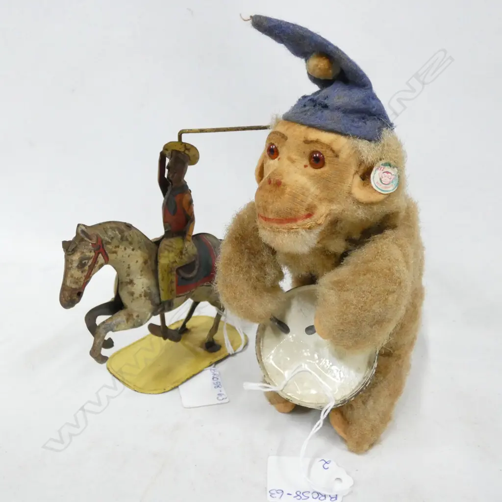 2 OLD WIND UP TOYS; COWBOY W LASSO ON HORSE (H.130MM) & MONKEY PLAYING DRUM (H.180MM) Image 1++